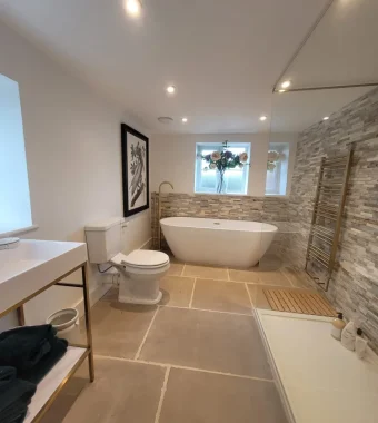 spacious bathroom natural tiles